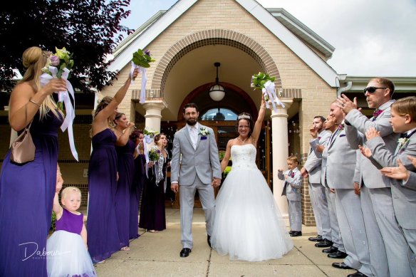 A photo of Jestina and Michael right after their wedding ceremony. Photo by DAVE DABOUR