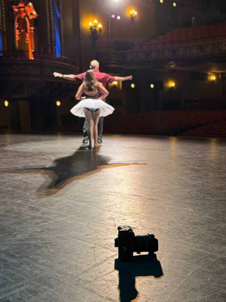 Dave Dabour Photography discusses a pose with one of his dance ambassadors at the State Theatre